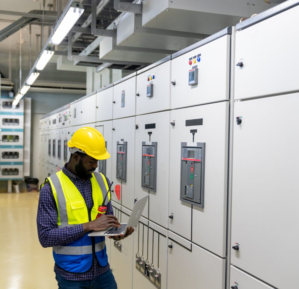 Engineer inspecting a switchgear panel