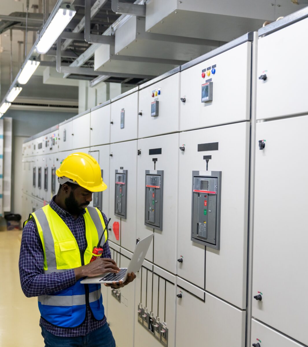 Engineer inspecting a switchgear panel
